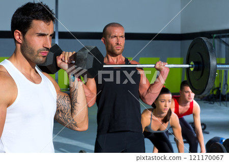 gym group with weight lifting bar crossfit workout 121170067