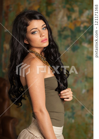 Fashion portrait of fashion model woman with healthy long hairstyle and trendy make-up.  121171368