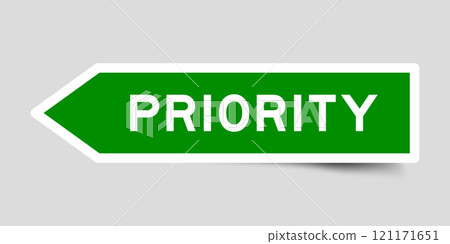Green color arrow shape sticker label with word priority on gray background 121171651