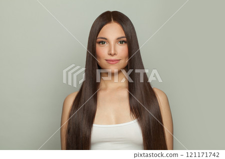 Pretty model woman with sleek long shiny brown hair. Cosmetology, hair and skin care Pretty model woman with sleek long shiny brown hair. Cosmetology, hair and skin care 121171742