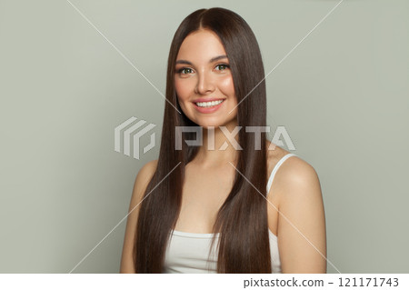 Posing model woman with sleek long shiny brown hair. Cosmetology, hair and skin care Posing model woman with sleek long shiny brown hair. Cosmetology, hair and skin care 121171743