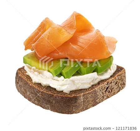 Rye bread slice with smoked salmon, avocado and cream cheese isolated on white background with clipping path 121171836