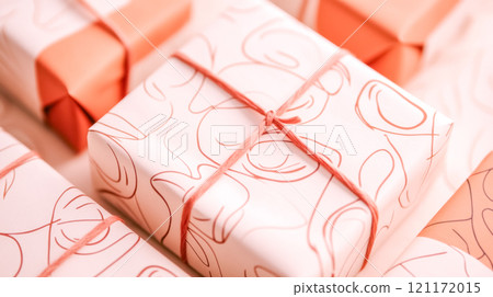 Wrapped gifts showing minimalist line drawings on wrapping paper 121172015