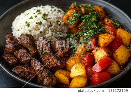 Savory meat and vegetable dish served with fluffy rice for a satisfying meal experience 121172199