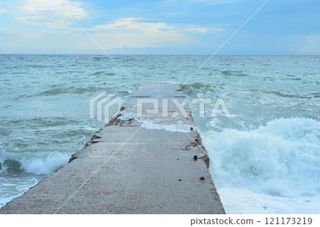 Background landscape view of Sudak Bay, the city of Sudak and its embankment in Crimea. 121173219
