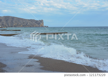 Background landscape view of Sudak Bay, the city of Sudak and its embankment in Crimea. Background landscape view of Sudak Bay, the city of Sudak and its embankment in Crimea. 121173220