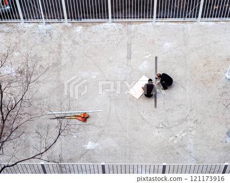 top view of repair and marking of sports ground top view of repair and marking of sports ground 121173916