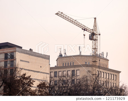 construction crane in city in evening twilight 121173929