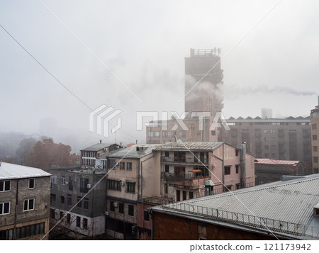 smoke, smog and fog over in Yerevan city in winter 121173942