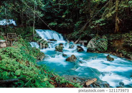 River with blue fresh water and cascade waterfalls in tropical jungle River with blue fresh water and cascade waterfalls in tropical jungle 121173973