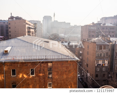 residential houses in Yerevan city with urban smog 121173997