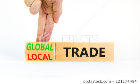 Global or local trade symbol. Concept words Global trade Local trade on beautiful wooden blocks. Beautiful white background. Businessman hand. Business Global or local trade concept. Copy space 121174484