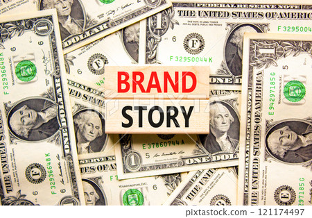 Brand story branding symbol. Concept words Brand story on beautiful wooden blocks. Dollar bills. Beautiful background from dollar bills. Business brand story branding concept. Copy space. 121174497