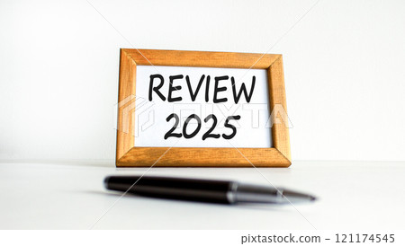 Planning review 2025 new year symbol. Concept words Review 2025 on beautiful wooden picture frame. Beautiful white background. Black pen. Business review 2025 new year concept. Copy space. Planning review 2025 new year symbol. Concept words Review 2025 on beautiful wooden picture frame. Beautiful white background. Black pen. Business review 2025 new year concept. Copy space. 121174545