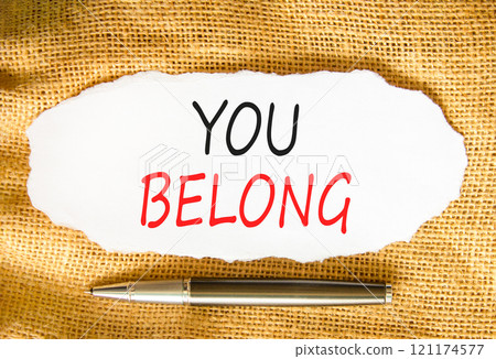 Belonging and you belong symbol. Concept words You belong on beautiful white paper. Beautiful canvas background. Beautiful metallic pen. Business belonging and you belong concept. Copy space. 121174577