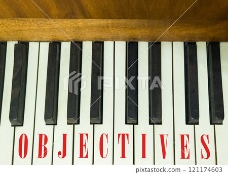Objectives symbol. Concept word Objectives on beautiful keys of the old retro piano. Beautiful piano-keys background. Black and white keys of the piano. Business objectives concept. Copy space. Objectives symbol. Concept word Objectives on beautiful keys of the old retro piano. Beautiful piano-keys background. Black and white keys of the piano. Business objectives concept. Copy space. 121174603
