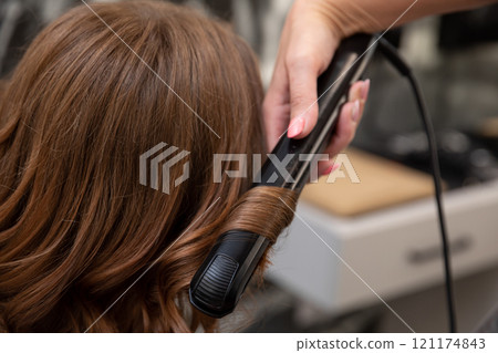 Styling Hair with a Straightener Achieving Perfect Waves and Beautiful Curls with Ease and Style Styling Hair with a Straightener Achieving Perfect Waves and Beautiful Curls with Ease and Style 121174843