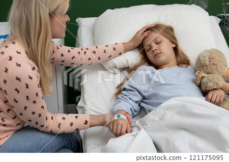 A Tender Moment in Hospital A Mother Comforting Her Sick Child with Love and Care 121175095