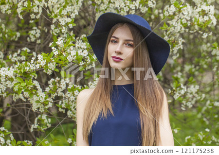 Attractive young woman with natural make-up and long smooth straight hair posing Attractive young woman with natural make-up and long smooth straight hair posing 121175238