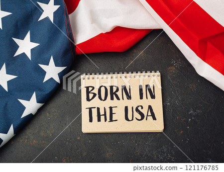 Piece of paper with the words Born in the USA written on it Piece of paper with the words Born in the USA written on it 121176785