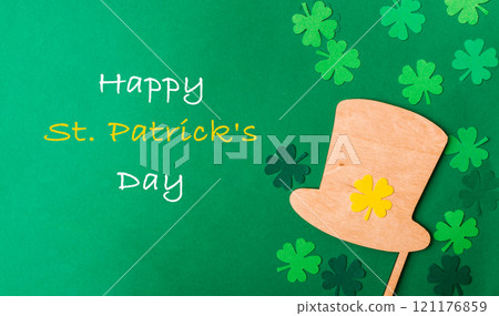 Green background with a hat and shamrock on it 121176859
