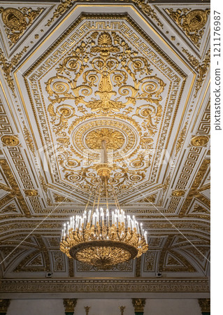 Elegant Chandelier Hangs From Intricately Designed Ceiling in Ornate Hall Elegant Chandelier Hangs From Intricately Designed Ceiling in Ornate Hall 121176987