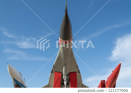Fighter Jet on Display Against a Clear Blue Sky in an Outdoor Exhibition 121177008