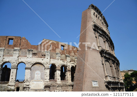 Walls of the Roman Colosseum in Rome, Italy, sunny day, clear blue sky Walls of the Roman Colosseum in Rome, Italy, sunny day, clear blue sky 121177511