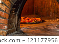 Neapolitan pizza, freshly cooked in a wood-burning oven. 121177956