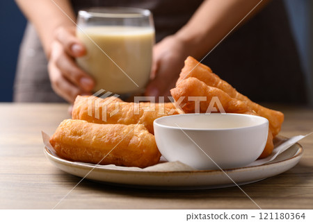 Asian deep fried dough eaten with soy milk and condensed milk, Thai style breakfast Asian deep fried dough eaten with soy milk and condensed milk, Thai style breakfast 121180364