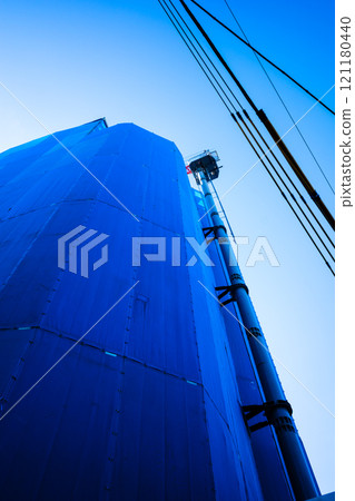 Apartment buildings under construction in the city and tower cranes Apartment buildings under construction in the city and tower cranes 121180440