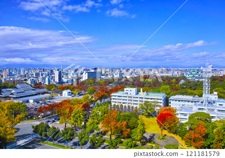 A view of Nagoya City in the autumn foliage season, including the castle, seen from Naka Ward to the northwest A view of Nagoya City in the autumn foliage season, including the castle, seen from Naka Ward to the northwest 121181579