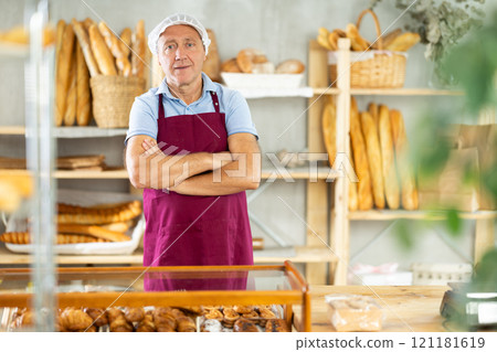 Man seller of bakery store is standing in trading floor, waiting for visitors 121181619