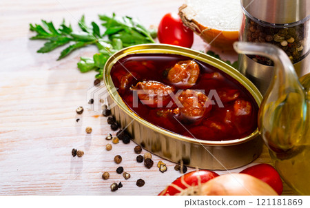 Opened tin can of scallops 121181869