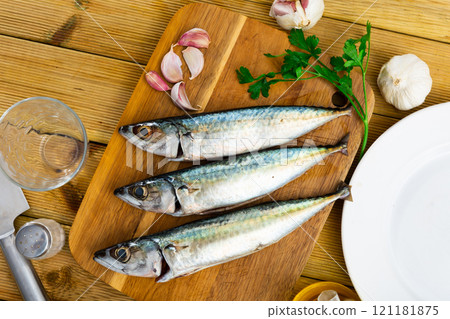 Raw mackerel fish served to table Raw mackerel fish served to table 121181875