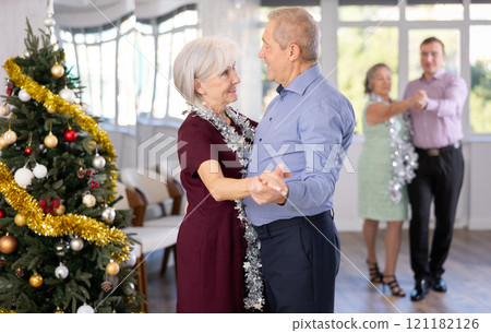 Elderly man and elderly woman dance tango 121182126