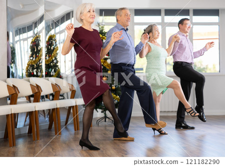 Group of men and women dancing folk dance 121182290