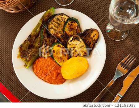 Grilled vegetables served with romesco sauce Grilled vegetables served with romesco sauce 121182382