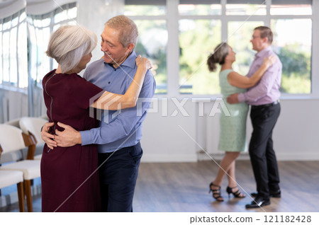 Elderly man and elderly woman dance waltz 121182428