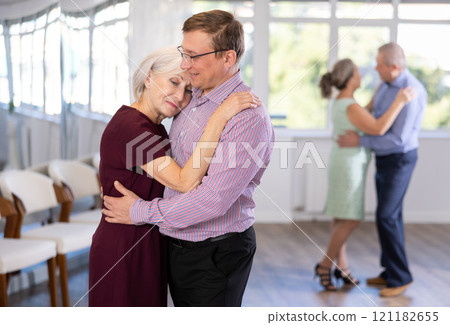 Adult man and elderly woman dance waltz 121182655