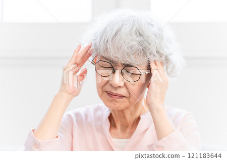 Senior woman with headache 121183644