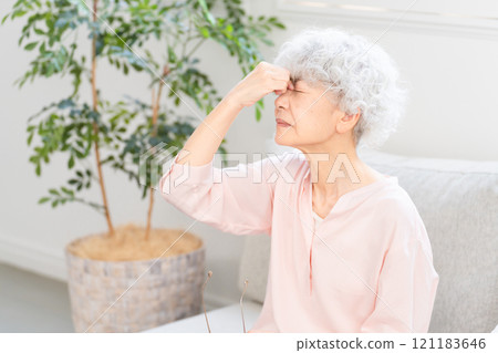 Senior woman holding her eyes Senior woman holding her eyes 121183646