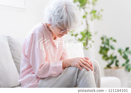 Senior woman suffering from knee pain Senior woman suffering from knee pain 121184101