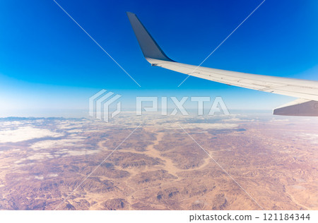 Aerial view on arabian desert and Red sea mountains from airplane 121184344