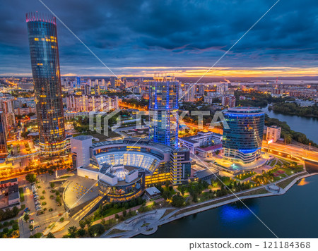 Yekaterinburg city and pond aerial panoramic view at summer or early autumn night. Night city in the early autumn or summer. Yekaterinburg city and pond aerial panoramic view at summer or early autumn night. Night city in the early autumn or summer. 121184368