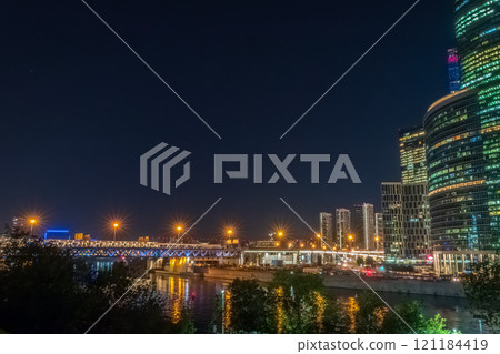 The scyscrapers of the Moscow City at night and the Dorogomilovsky bridge with illumination. Translation of text - street names: Krasnopresnenskaya, center, etc. The scyscrapers of the Moscow City at night and the Dorogomilovsky bridge with illumination. Translation of text - street names: Krasnopresnenskaya, center, etc. 121184419