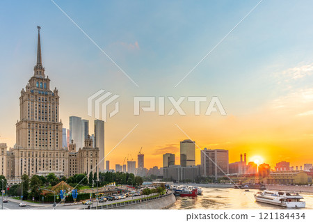 High-rise stalinist building near river at summer sunset in Moscow, Russia. Historic name is Hotel Ukraine. High-rise stalinist building near river at summer sunset in Moscow, Russia. Historic name is Hotel Ukraine. 121184434