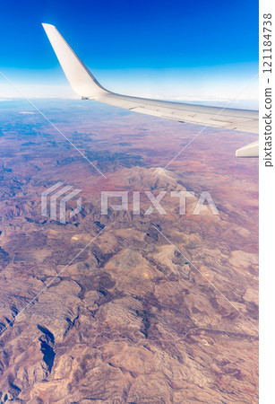 Aerial view on arabian desert and Red sea mountains from airplane 121184738
