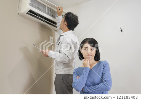 Woman suffering from air conditioner failure Woman suffering from air conditioner failure 121185408