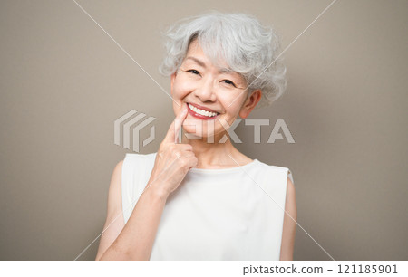 Senior woman wearing sleeveless top Dental care image Senior woman wearing sleeveless top Dental care image 121185901
